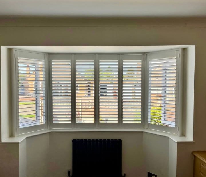 Second view of the Kirby Muxloe splay bay — white plantation shutters with louvres open